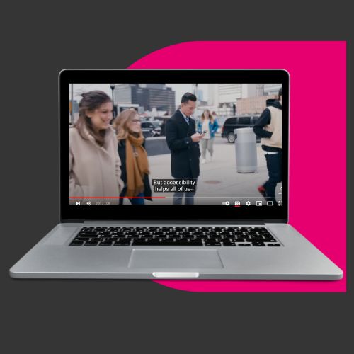 computer showing a video with captions. the video has a man looking at his phone with a voice over saying accessibility helps all of us